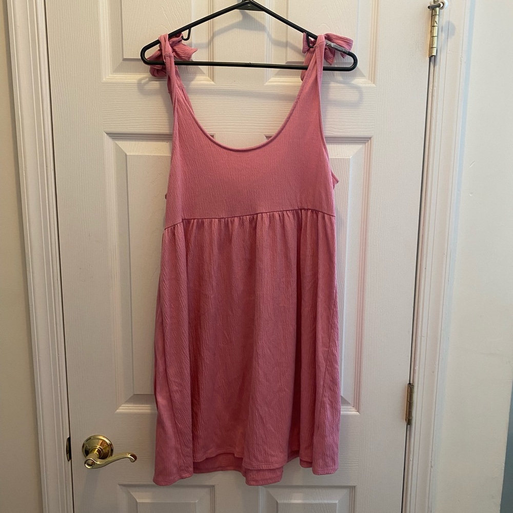 Adjustable bubblegum pink beach cover up. Very girly and flattering!